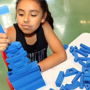 Blue foam building blocks allow kids to create structures and