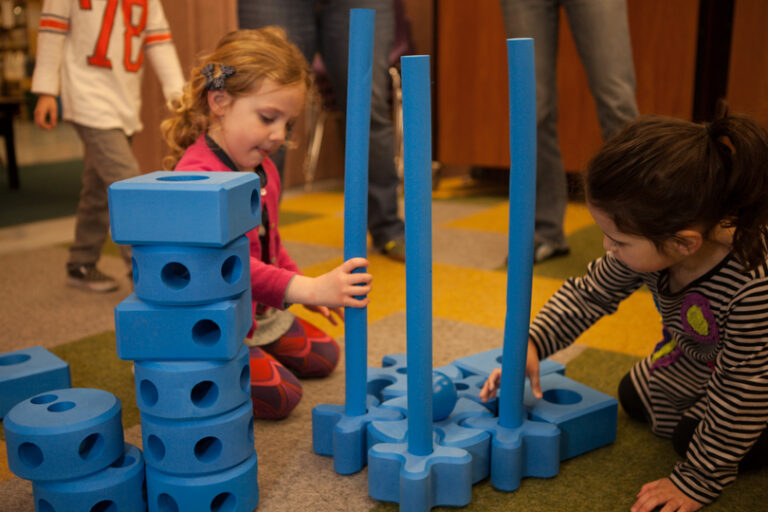 children playing with medium blue blocks