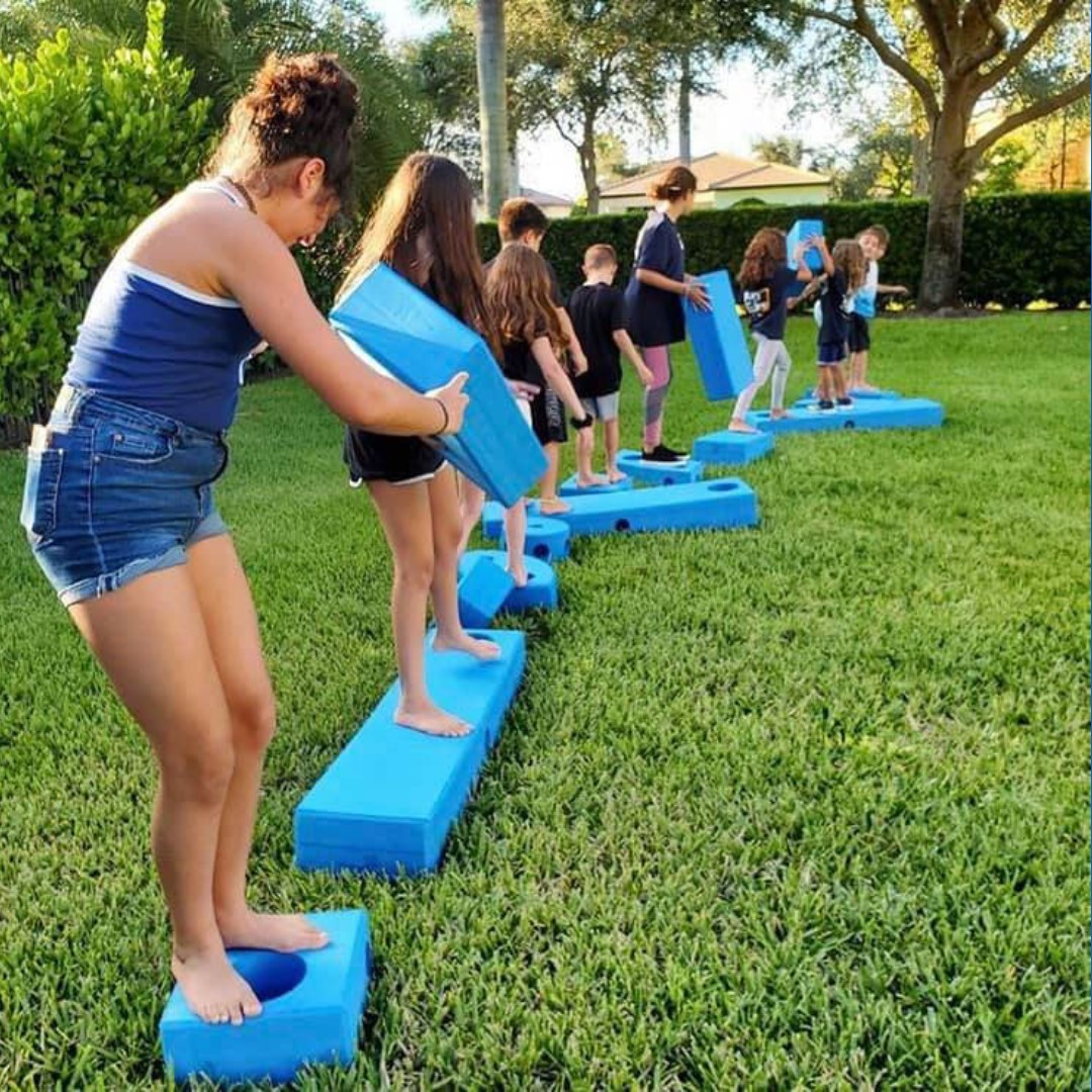 children playing with big blue blocks
