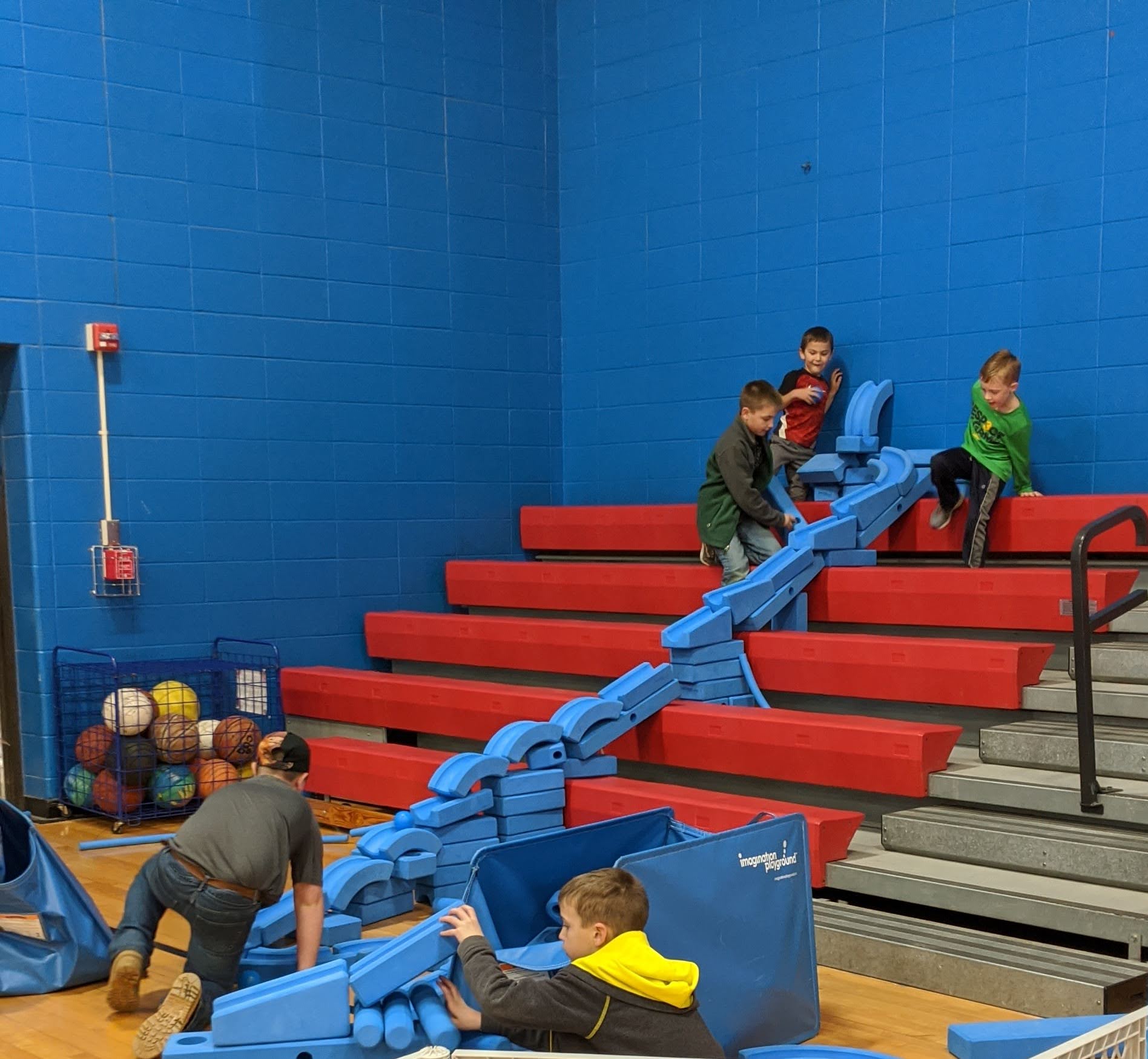 children playing with medium blue blocks