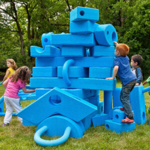 Children playing with Big Blue Blocks Outside