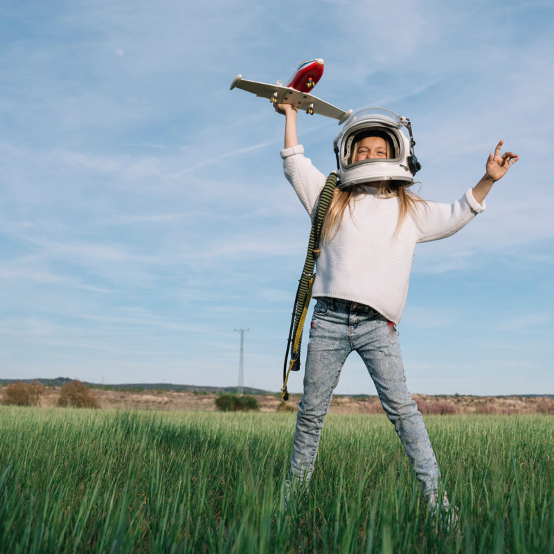 child playing with airplane