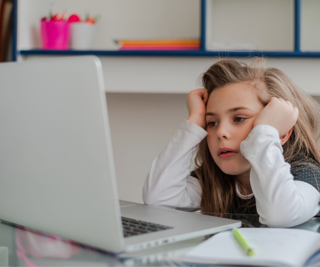 Student appearing disengaged while working on a computer instead of hands-on learning